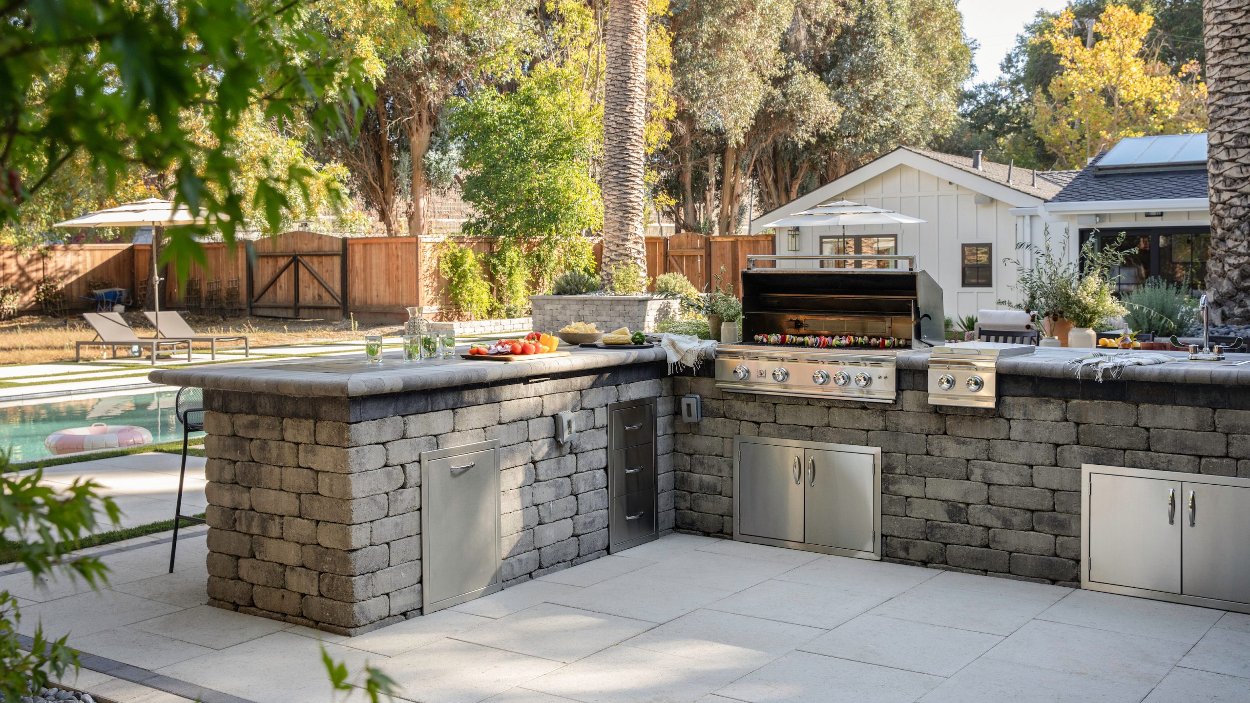 How can you make an outdoor kitchen feel more luxurious? Designer tips on making this hardworking space extra opulent