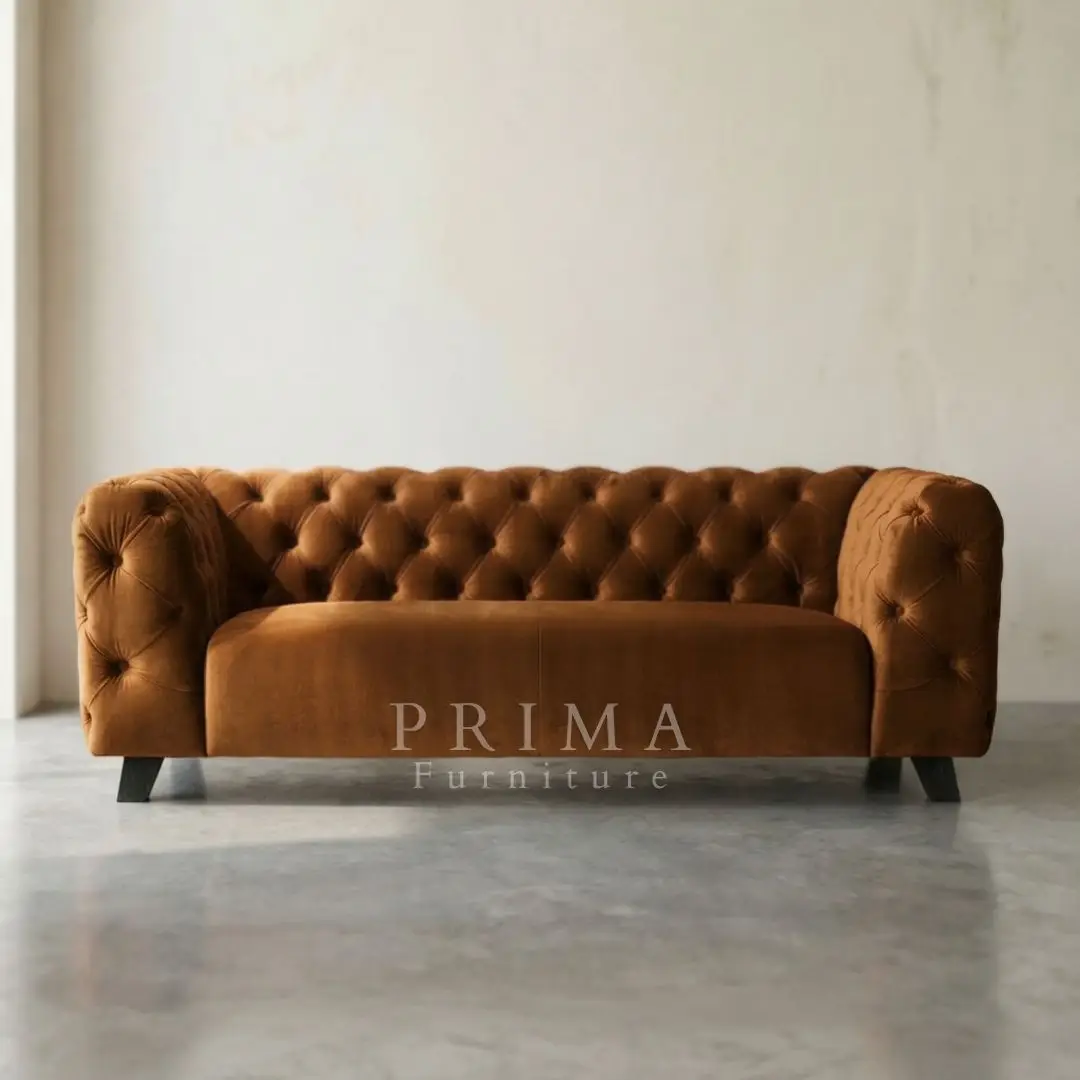 Luxurious brown Chesterfield sofa with velvet-like texture.