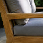 Smooth Teak Wood Armrest Joinery With Textured Gray Cushion