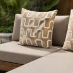 Taupe Cushions And Patterned Pillows On Outdoor Sofa